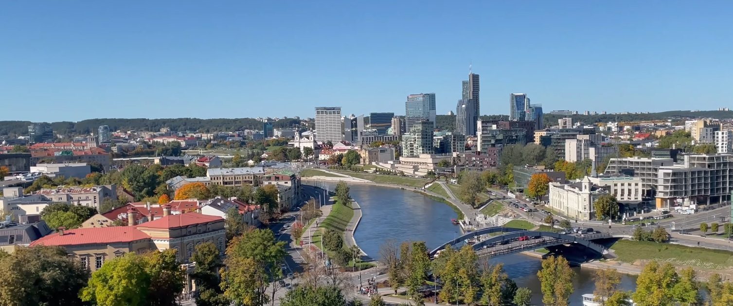 Panoramic view of the Neris river and modern Vilnius skyline