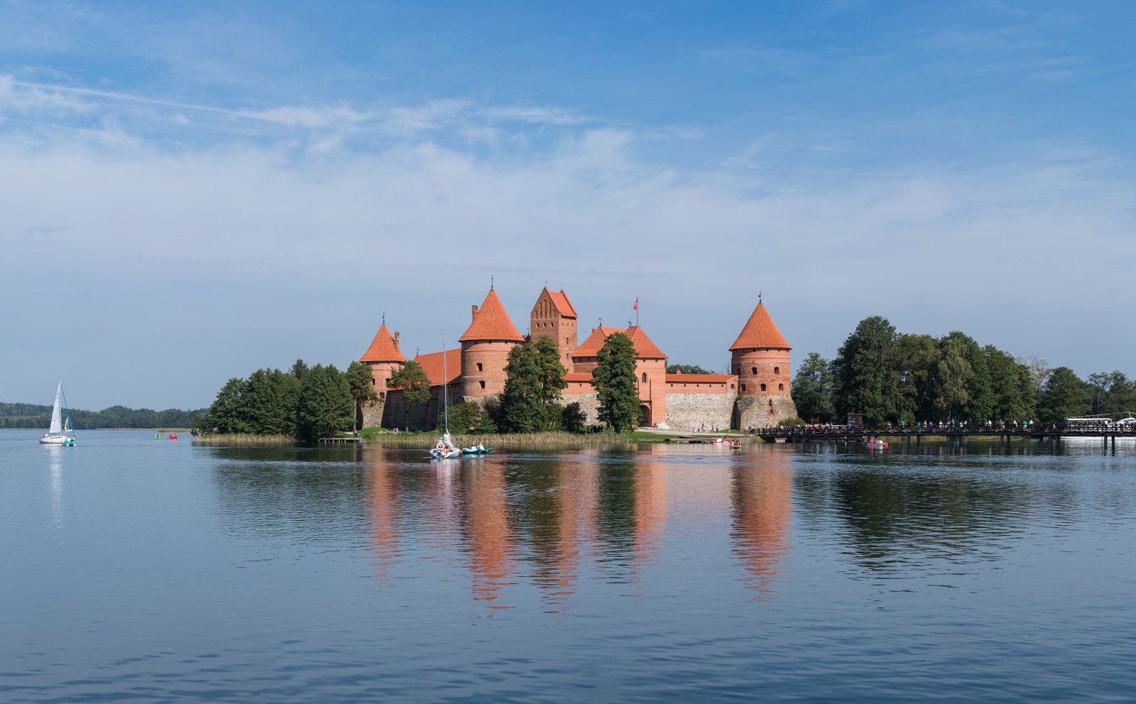 Trakai Island Castle, sailboats and reflections on Lake Galvė.